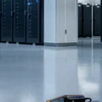Ruang server dan area UPS dengan lantai teknis rapi yang sedang dipersiapkan untuk survey epoxy antistatic