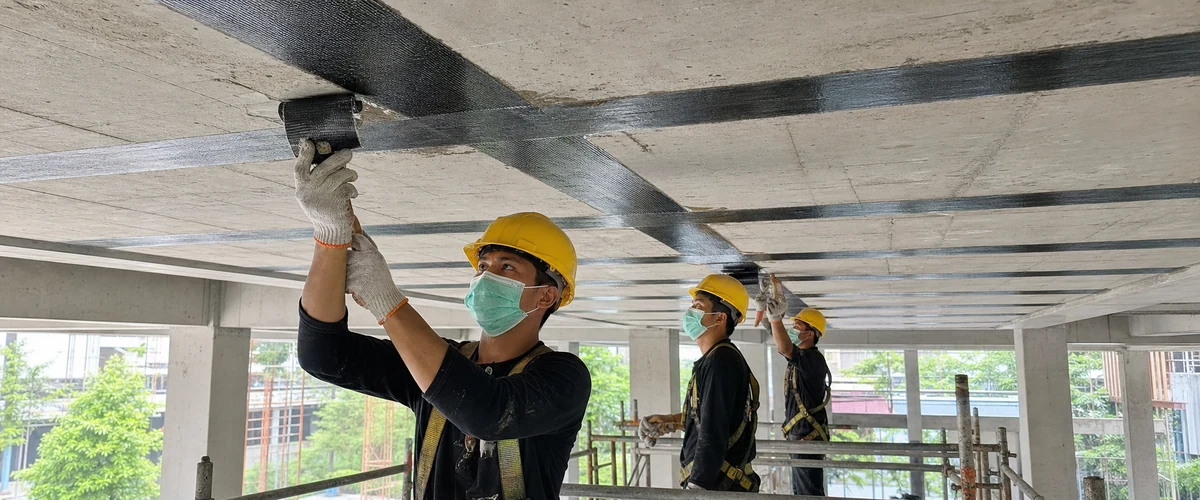 Carbon fiber laminate pada pelat beton existing untuk peningkatan kapasitas ruang